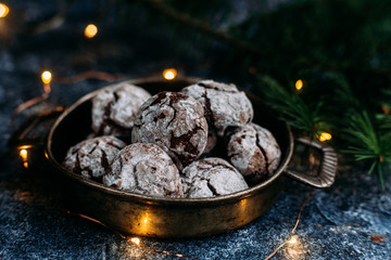 Chocolate Crinkle Cookies on a blue table. New Year, Christmas