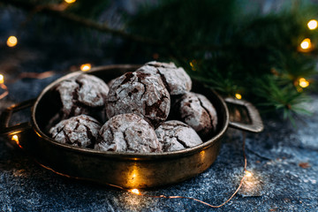 Chocolate Crinkle Cookies on a blue table. New Year, Christmas