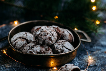 Chocolate Crinkle Cookies on a blue table. New Year, Christmas