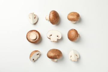 Obraz premium Flat lay with champignon mushrooms on white background, space for text