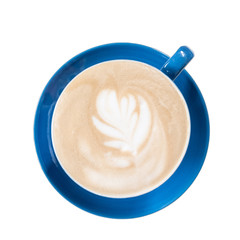 Homemade cappuccino coffee latte art on blue cup isolated background. Top view