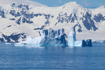 Fototapeta na wymiar A group of icebergs among the islands around the Antarctic Peninsula, Antarctica