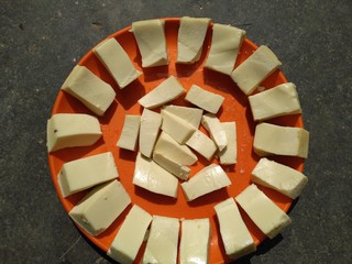 Cheese pieces in the plate.