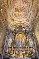 Fototapeta na wymiar COMO, ITALY - MAY 9, 2015: The presbytery of church Chiesa di San Andrea Apostolo (Brunate) with the frescoes (st. Andrew and Maurice) by Giampaolo Recchi (1679 - 1681).