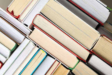 Many books on whole background, top view. Study concept