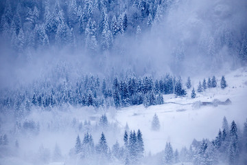 Wooden cottage in a fairy-tale winter landscape.