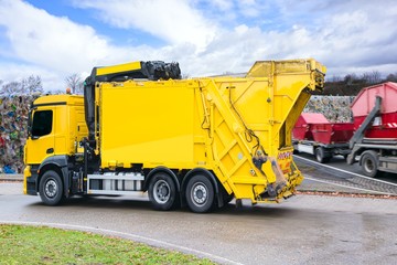 Urban recycling waste and garbage services , Bright yellow truck
