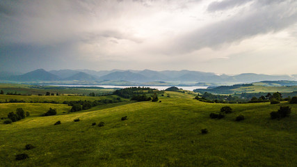 Aerial view of a green field in the Tatra Mountains in summer