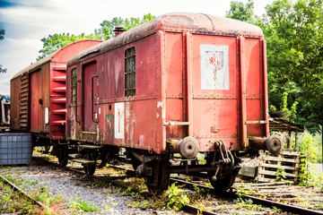 Plakat Various rusted wagons and train on the tracks
