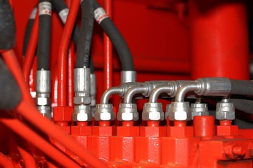 High pressure hydraulic hoses connected to the manipulator control system