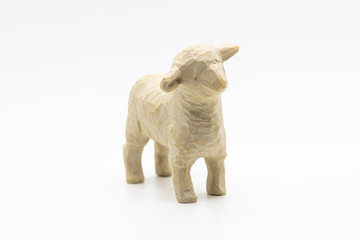 Fototapeta na wymiar Christmas ornament Lamb figurine in wood