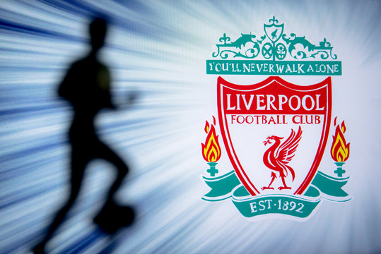 LIVERPOOL, ENGLAND, JULY. 1. 2019: Liverpool Football club logo, Premier League, England. Soccer player silhouette.