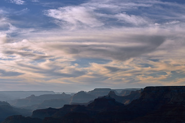 Naklejka na ściany i meble Landscape of clouds and cliffs near sunset, South Rim, Grand Canyon National Park, Arizona, USA