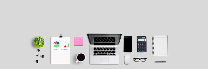 Top view office desk and supplies with copy space. Creative flat lay photo of workspace desk - panoramic background