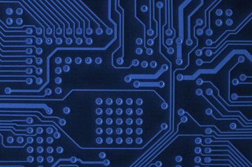 Close up of colored micro circuit board. Abstract technology background. phantom classic blue color