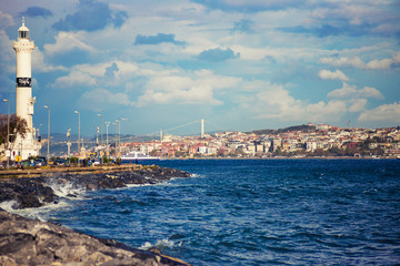 Kennedy avenu with lighthouse and Bosphorus Bridge in the distance, Istanbul, Turkey