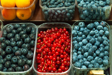Macro photo berries fruits. Close up berries at market store. Fresh berries fruits. Fruits background. Healthy eating. Fruits on grocery market