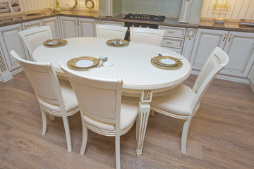 Furniture of the classic italian kitchen. Modern style. Design background. Home decoration. Modern home interior. Modern kitchen design in a light interior. Wood cupboard. Italian kitchen furniture .