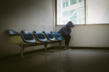Sad Asia woman sitting at stair case.Depression and problem concept.