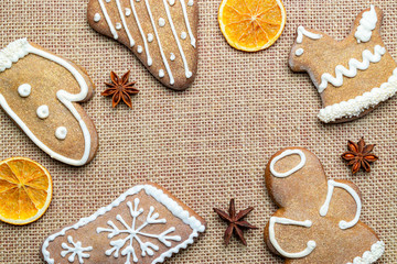 Christmas background. Handmade festive gingerbread cookies. Copy space for text. Winter holidays background mock up