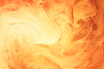 Abstract liquid yellow fire. A flash of sunlight in outer space, swirling smoke