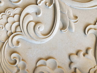 Fototapeta na wymiar Low relief cement Chinese style handcraft of flower stucco.