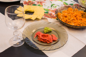 Pink ginger lies on a brown plate
