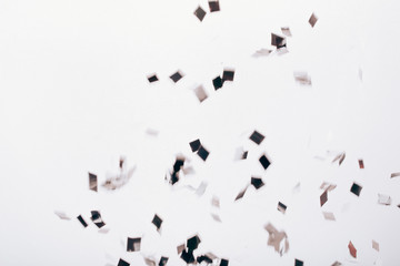 Falling solver confetti on neutral grey backdrop.