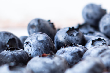 Fresh blueberries on a white background.