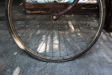 Vintage bicycle wheel with flat tire