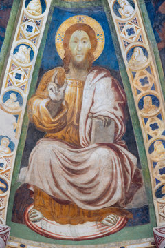 COMO, ITALY - MAY 9, 2015: The old fresco of Jesus the teacher in church Basilica di San Abbondio by unknown artist "Maestro di Sant'Abbondio" (1315 - 1324).