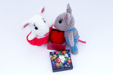 A gift from the heart of a colored cardboard box with a lid.