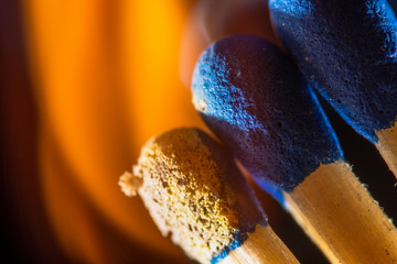 macro photo of burning matches on black, abstract background with fire