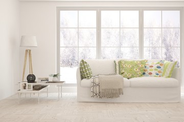 Stylish room in white color with sofa and winter landscape in window. Scandinavian interior design. 3D illustration