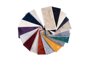 Types and samples of carpets in different colors. Carpets for rooms, apartments and houses