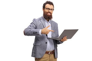 Bearded man holding a laptop and pointing at the computer