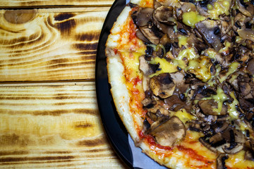 pizza with mushrooms, vegetables and cheese, top view, selective focus