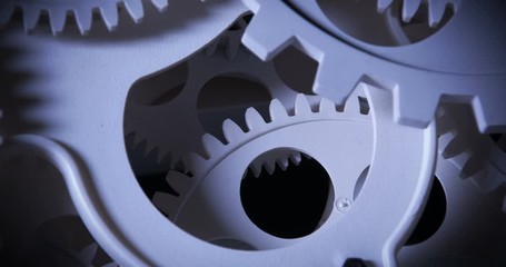 Close-up rotation of the plastic gears inside a clock mechanism