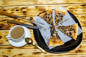 white cup of coffee with milk and pizza with mushrooms vegetables and cheese, top view, selective focus