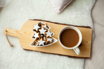 Christmas cookies stars, cocoa on a wooden board.