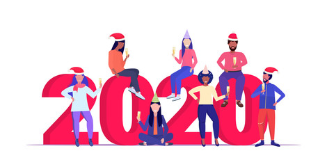 Fototapeta premium mix race people in santa hats drinking champagne celebrating corporate party merry christmas happy new year winter holidays celebration concept full length horizontal vector illustration