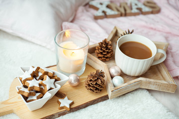 Fototapeta na wymiar Christmas cookies stars, cocoa on a wooden board. Christmas decor, candles, plaid.