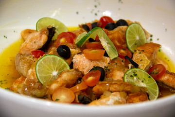  grilled salmon with butter sauce in dish