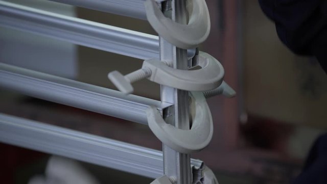 White Aluminum profiles after process of anodizing of aluminum in the enterprise. Metal processing. production line factory
