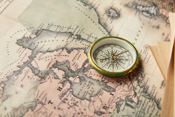 Fototapeta na wymiar vintage compass on map background