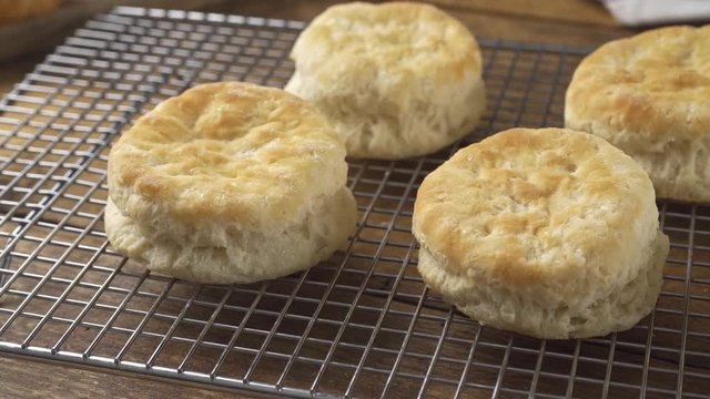 An assortment of tea biscuits on a cooling rack.