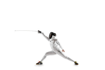 Teen girl in fencing costume with sword in hand isolated on white studio background. Young female...