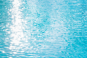 water background pure water surface blue ocean color scenery soft focus with beautiful white sunlight glitter