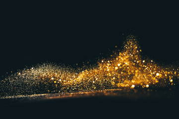 Golden overlay background of golden lights with bokeh effect. Includes copy space