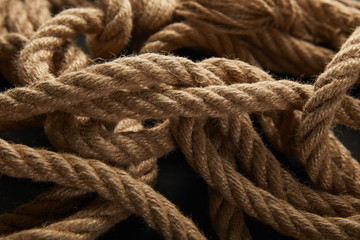 Fototapeta na wymiar close up view of rope on black background